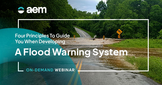 Four principles to guide you when developing a flood warning system. Image of flooded roadway.